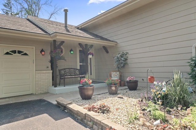 6469 Deerwood Ln N, Maple Grove, MN 55369 - property entrance featuring covered porch, brick siding, and an attached garage