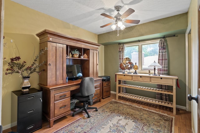6469 Deerwood Ln N, Maple Grove, MN 55369 - office with light wood-style floors, a ceiling fan, and a textured ceiling