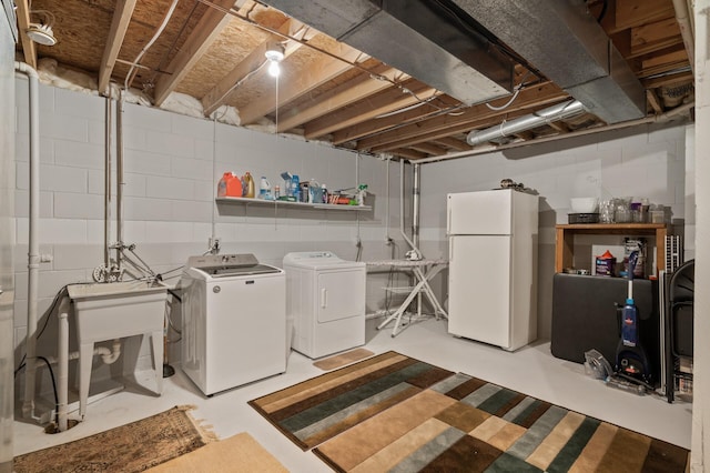 6469 Deerwood Ln N, Maple Grove, MN 55369 - washroom with washing machine and clothes dryer and concrete block wall
