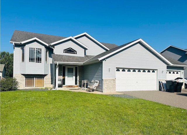 11162 Olympia Ave, Becker, MN 55308 - tri-level home with an attached garage, a front lawn, asphalt driveway, and roof with shingles