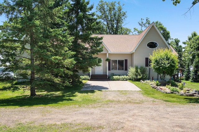 2282 71st St, Georgetown Twp, WI 54853 - view of front of property with a shingled roof, driveway, and a front lawn