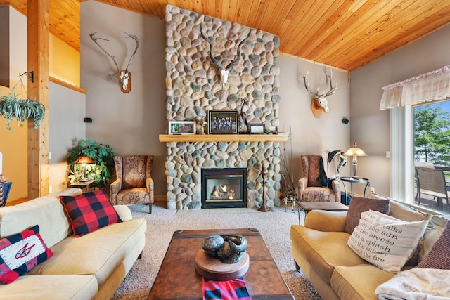 2282 71st St, Georgetown Twp, WI 54853 - living area featuring a stone fireplace, wooden ceiling, and carpet floors