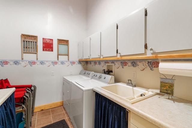 2282 71st St, Georgetown Twp, WI 54853 - laundry room with cabinet space, separate washer and dryer, and light tile patterned floors