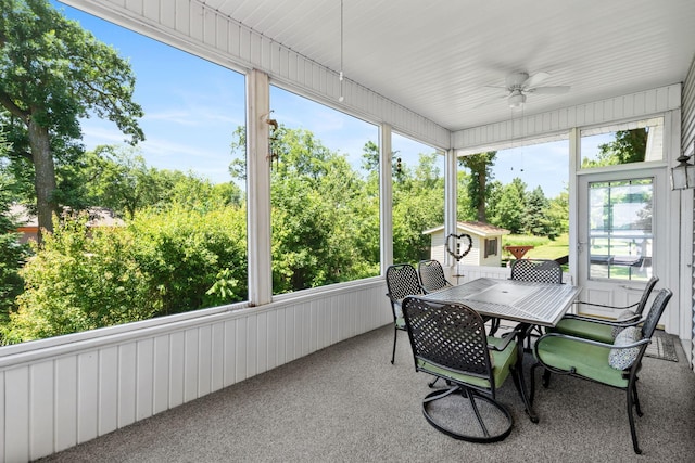 2282 71st St, Georgetown Twp, WI 54853 - sunroom with a ceiling fan, view of scattered trees, outdoor dining area, and healthy amount of natural light