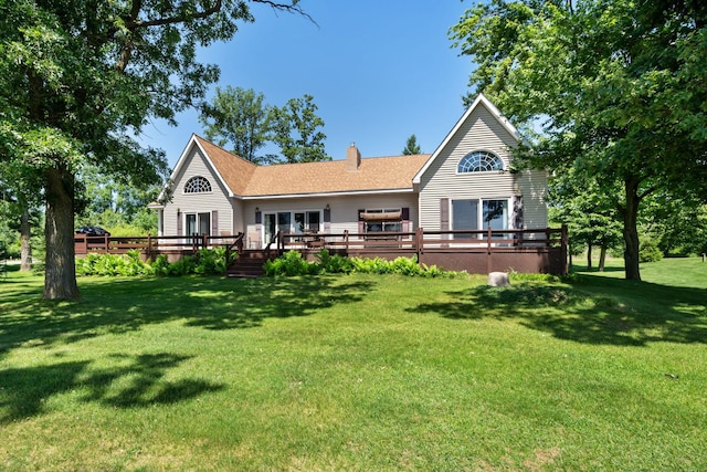 2282 71st St, Georgetown Twp, WI 54853 - back of property with a deck, a chimney, and a yard