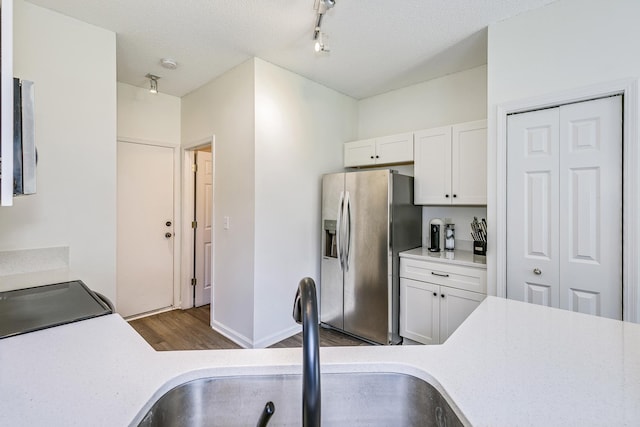 16835 78th Pl N, Maple Grove, MN 55311 - kitchen with stainless steel refrigerator with ice dispenser, wood finished floors, light countertops, white cabinetry, and a textured ceiling
