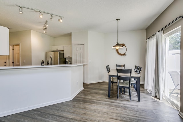 16835 78th Pl N, Maple Grove, MN 55311 - dining space with dark wood-type flooring and rail lighting