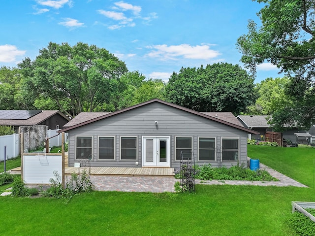 607 1st St, Marshall, MN 56258 - back of property featuring french doors and a wooden deck