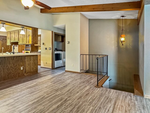 607 1st St, Marshall, MN 56258 - unfurnished living room with wood finished floors and ceiling fan