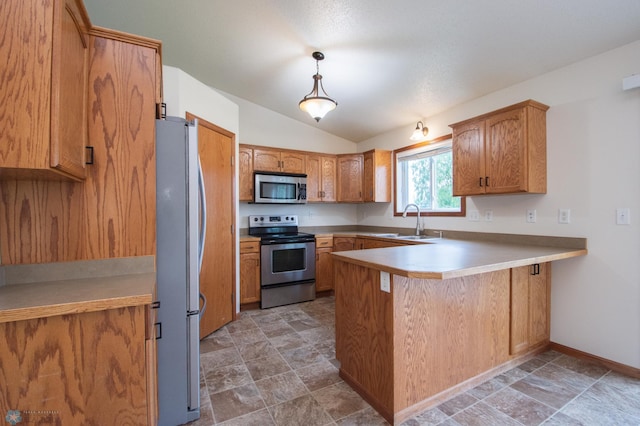3661 Taylor St S, Fargo, ND 58104 - kitchen featuring stainless steel appliances, a peninsula, stone finish floors, vaulted ceiling, and hanging light fixtures