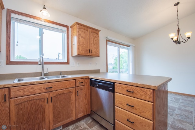 3661 Taylor St S, Fargo, ND 58104 - kitchen featuring stainless steel dishwasher, a peninsula, stone finish floors, a chandelier, and decorative light fixtures