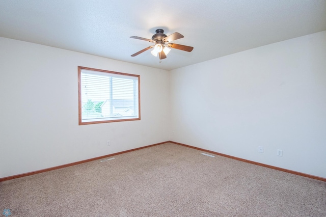 3661 Taylor St S, Fargo, ND 58104 - carpeted spare room featuring a ceiling fan and baseboards