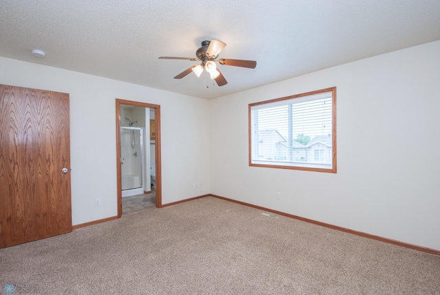 3661 Taylor St S, Fargo, ND 58104 - unfurnished bedroom with light carpet, a ceiling fan, and connected bathroom