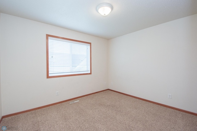3661 Taylor St S, Fargo, ND 58104 - empty room with carpet flooring and baseboards
