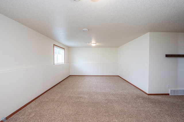 3661 Taylor St S, Fargo, ND 58104 - unfurnished room with carpet flooring and a textured ceiling