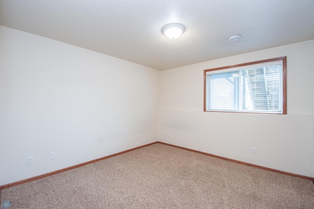 3661 Taylor St S, Fargo, ND 58104 - carpeted spare room with a textured ceiling and baseboards