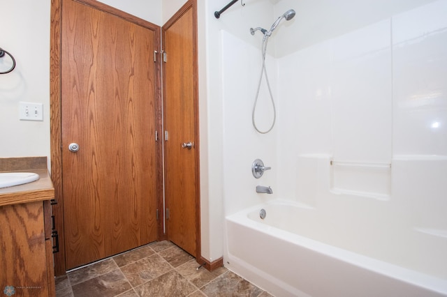 3661 Taylor St S, Fargo, ND 58104 - full bathroom with shower / bath combination, vanity, and stone finish floors