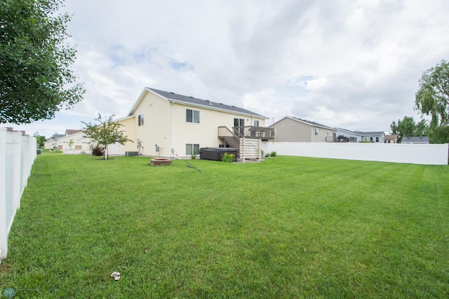 3661 Taylor St S, Fargo, ND 58104 - back of house with a fire pit, a wooden deck, a fenced backyard, and stairs