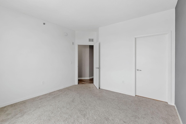 929 Portland Ave Unit 2106, Minneapolis, MN 55404 - unfurnished bedroom with carpet and baseboards