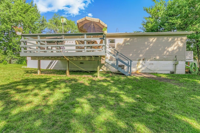 57975 226th St, Litchfield, MN 55355 - rear view of property featuring a wooden deck, stairs, and a lawn