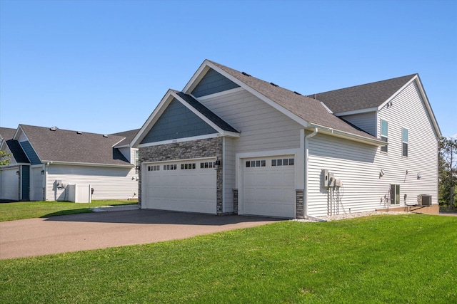 15005 Quintana St NW, Ramsey, MN 55303 - view of property exterior with a garage, driveway, and a yard