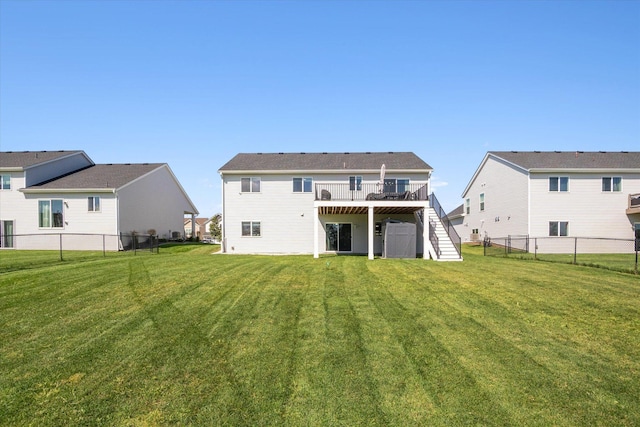 15005 Quintana St NW, Ramsey, MN 55303 - back of house featuring stairs, a wooden deck, and a fenced backyard