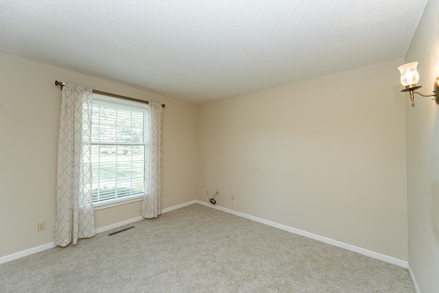 2051 Carriage Dr SW Unit 2051D, Rochester, MN 55902 - spare room with carpet flooring and a textured ceiling