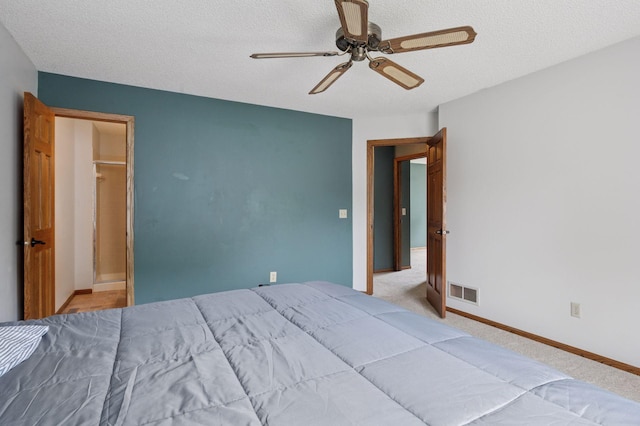 10989 Eagle Lake Blvd, Maple Grove, MN 55369 - carpeted bedroom with a textured ceiling and a ceiling fan