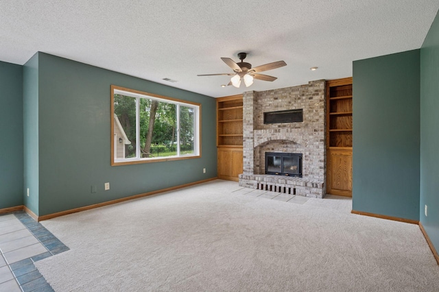 10989 Eagle Lake Blvd, Maple Grove, MN 55369 - unfurnished living room featuring a ceiling fan, a textured ceiling, built in shelves, a fireplace, and carpet