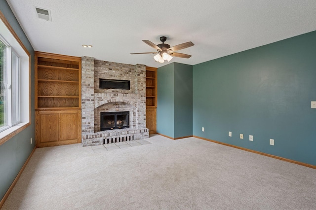10989 Eagle Lake Blvd, Maple Grove, MN 55369 - unfurnished living room featuring ceiling fan, a textured ceiling, carpet flooring, and built in features