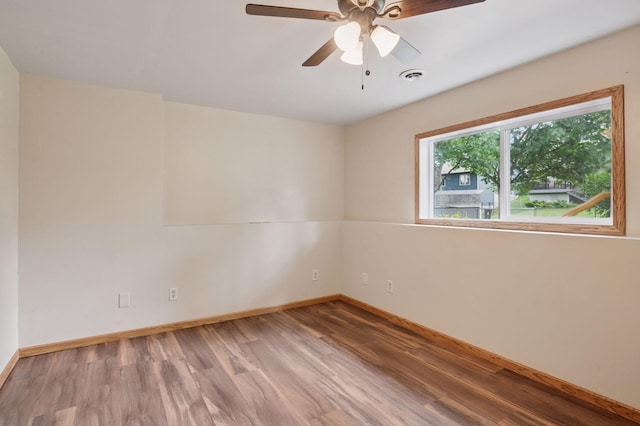 10989 Eagle Lake Blvd, Maple Grove, MN 55369 - unfurnished room with wood finished floors and a ceiling fan