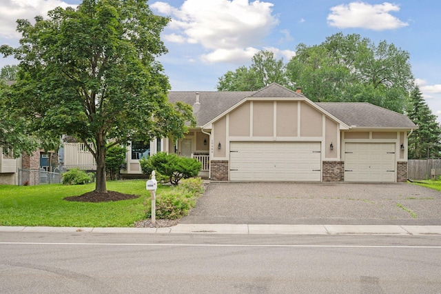 10989 Eagle Lake Blvd, Maple Grove, MN 55369 - view of front of property with a garage, brick siding, asphalt driveway, stucco siding, and roof with shingles