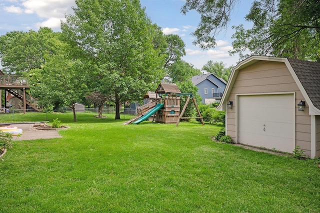 10989 Eagle Lake Blvd, Maple Grove, MN 55369 - view of yard featuring a playground, a garage, and an outbuilding