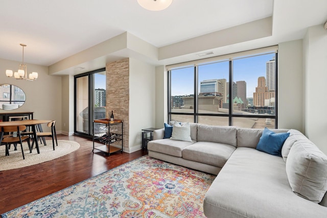 100 3rd Ave S Unit 706, Minneapolis, MN 55401 - living area with wood finished floors, a chandelier, and a skyline view