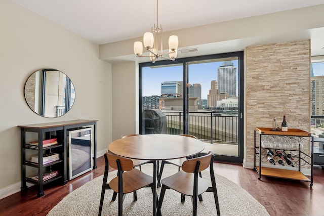 100 3rd Ave S Unit 706, Minneapolis, MN 55401 - dining room featuring wine cooler, wood finished floors, a view of skyline, and a chandelier