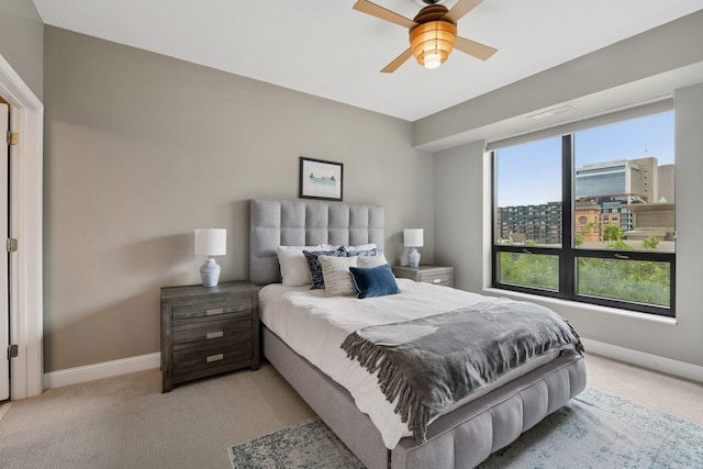 100 3rd Ave S Unit 706, Minneapolis, MN 55401 - bedroom featuring light carpet, a ceiling fan, and a view of city