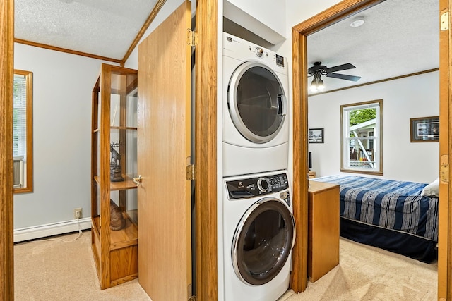 404 2nd St W, Jordan, MN 55352 - laundry area featuring a baseboard radiator, stacked washer / dryer, carpet, a textured ceiling, and crown molding