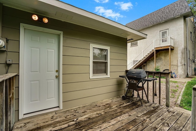 404 2nd St W, Jordan, MN 55352 - wooden deck with grilling area and stairway