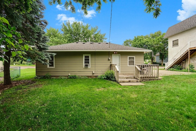 404 2nd St W, Jordan, MN 55352 - rear view of property with a yard and a wooden deck