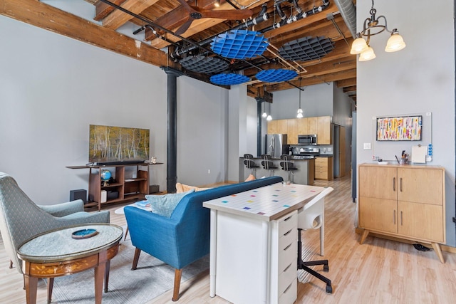 406 Wacouta St Unit 207, Saint Paul, MN 55101 - living area with light wood finished floors and beam ceiling