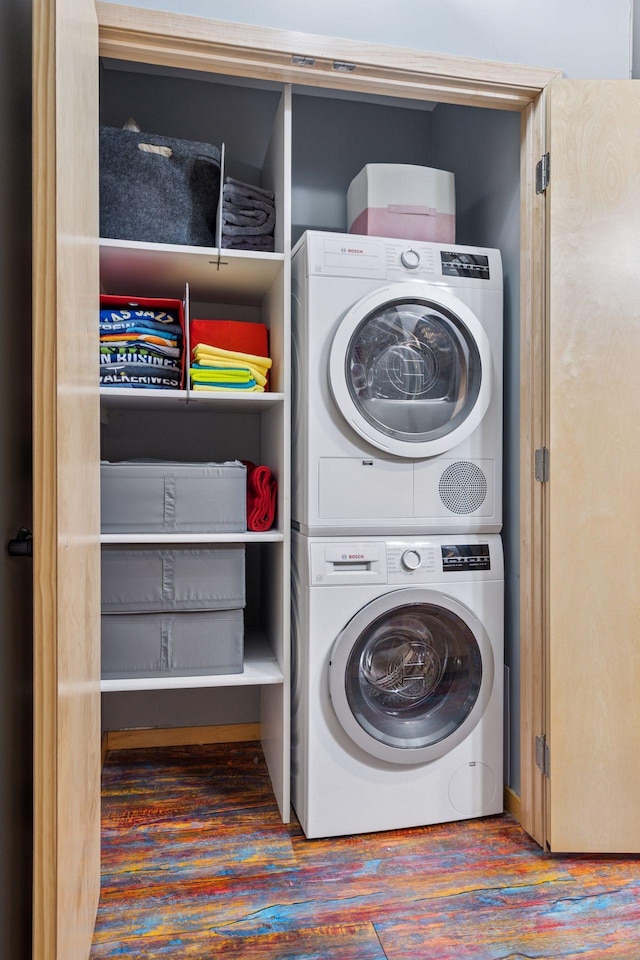 406 Wacouta St Unit 207, Saint Paul, MN 55101 - laundry room featuring stacked washing machine and dryer and wood finished floors