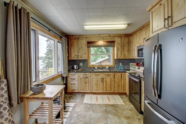 37566 Tulaby Lake Dr, Waubun, MN 56589 - kitchen featuring stainless steel appliances, tasteful backsplash, and light brown cabinetry