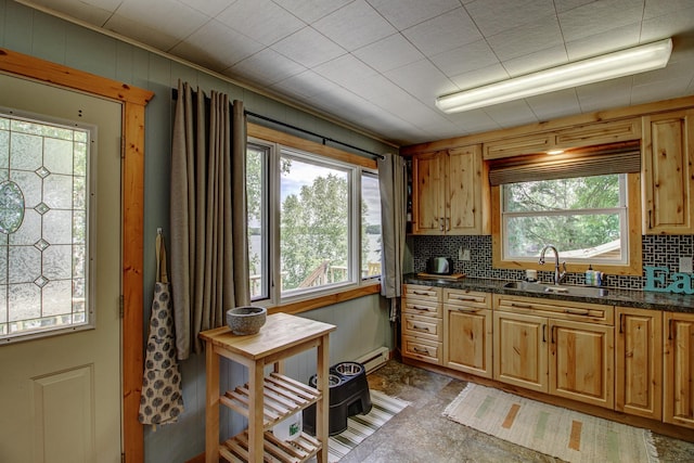 37566 Tulaby Lake Dr, Waubun, MN 56589 - kitchen featuring plenty of natural light, a baseboard radiator, backsplash, and crown molding