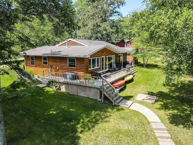 37566 Tulaby Lake Dr, Waubun, MN 56589 - back of house with a yard, roof with shingles, and a deck