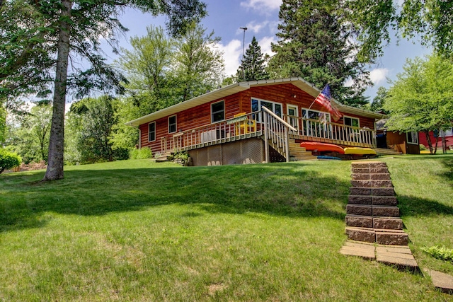37566 Tulaby Lake Dr, Waubun, MN 56589 - view of front of property with a front lawn, a deck, and stairs