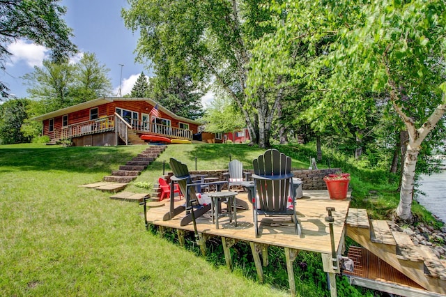 37566 Tulaby Lake Dr, Waubun, MN 56589 - view of green lawn with a wooden deck and a fire pit