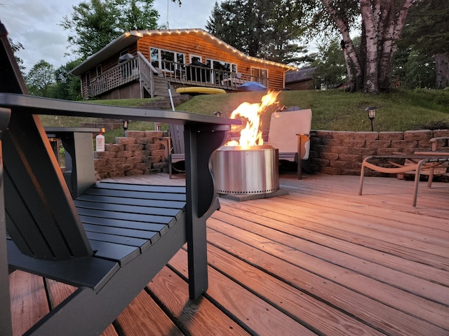 37566 Tulaby Lake Dr, Waubun, MN 56589 - wooden deck featuring an outdoor fire pit