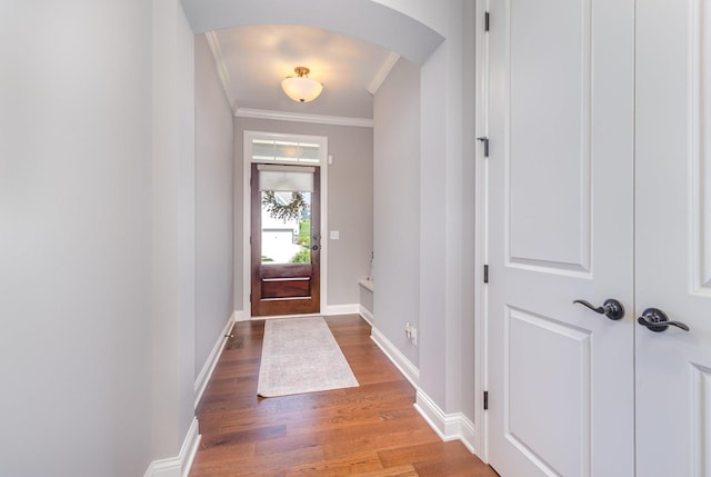1621 Dutch Lake Dr, Minnetrista, MN 55364 - entrance foyer featuring arched walkways, ornamental molding, and wood finished floors