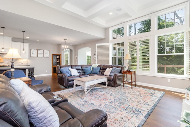 1621 Dutch Lake Dr, Minnetrista, MN 55364 - living area featuring arched walkways, recessed lighting, beam ceiling, wood finished floors, and coffered ceiling