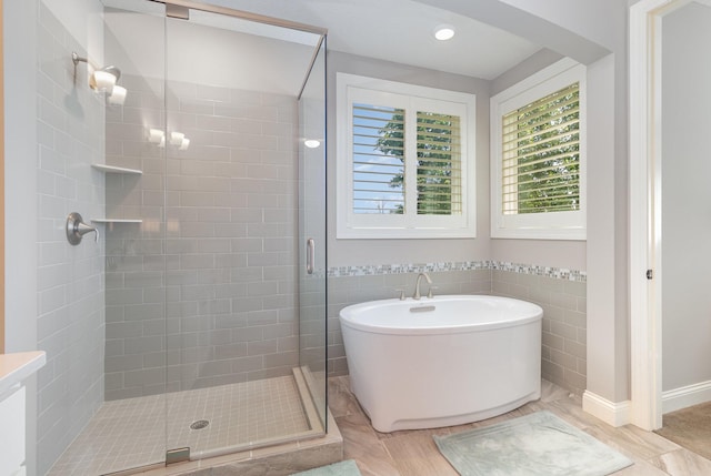 1621 Dutch Lake Dr, Minnetrista, MN 55364 - full bath with a shower stall, a freestanding tub, and recessed lighting